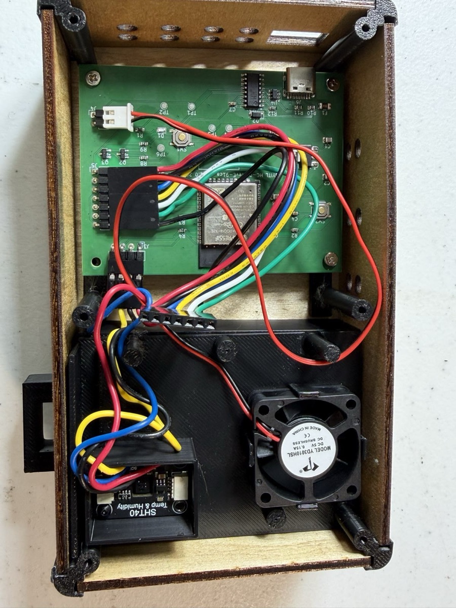 Inside the HC-01: the rev E circuit board on top, the fan and the sealed wet pan below